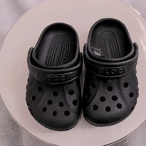 Crocs black slip on shoes